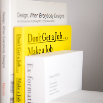 Three books stand next to each other on a white background